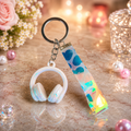 Teal Headphones and Holographic Pattern Keychain